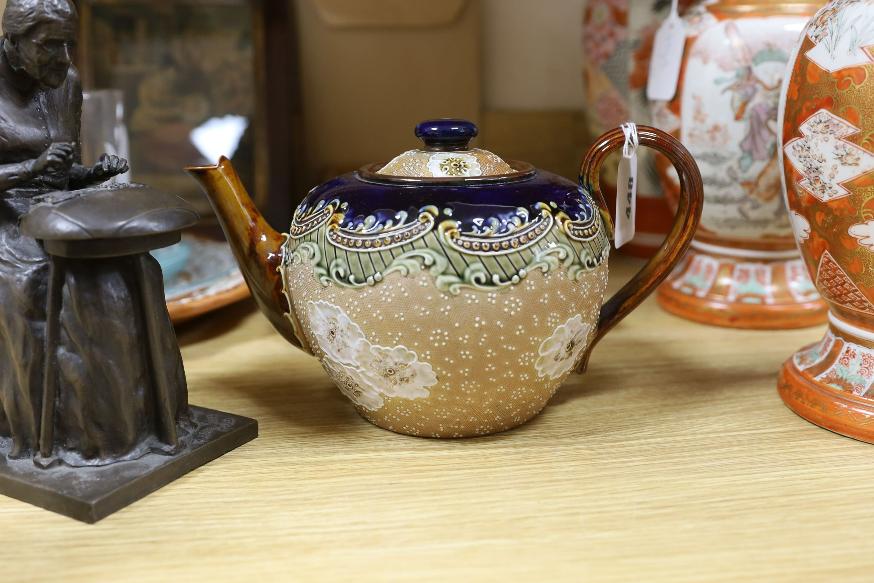 A cold cast bronze, Bobbin lace maker, similar carved wood figure, ceramic lace-pattern dish etc